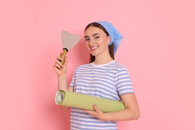 Photo of Portrait of young decorator on pink background