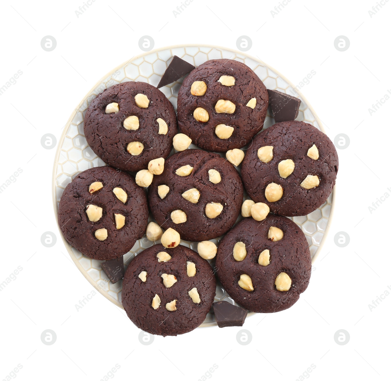 Photo of Tasty chocolate cookies with hazelnuts isolated on white, top view