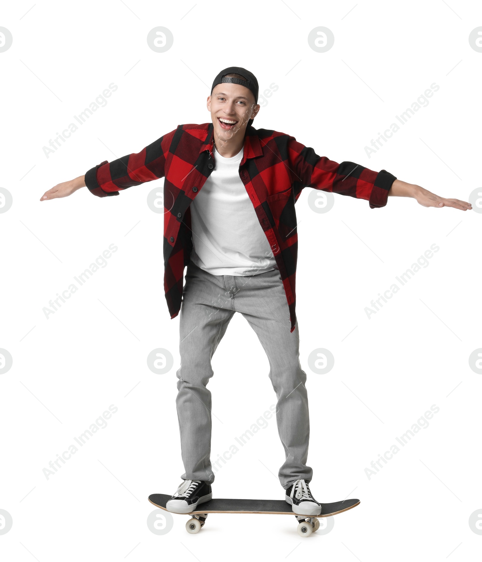 Photo of Happy man riding skateboard on white background