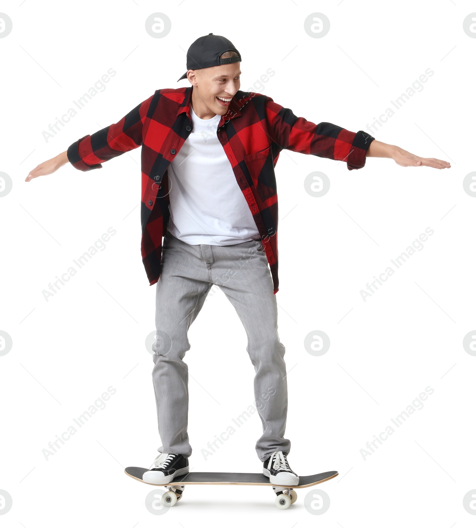 Photo of Happy man riding skateboard on white background