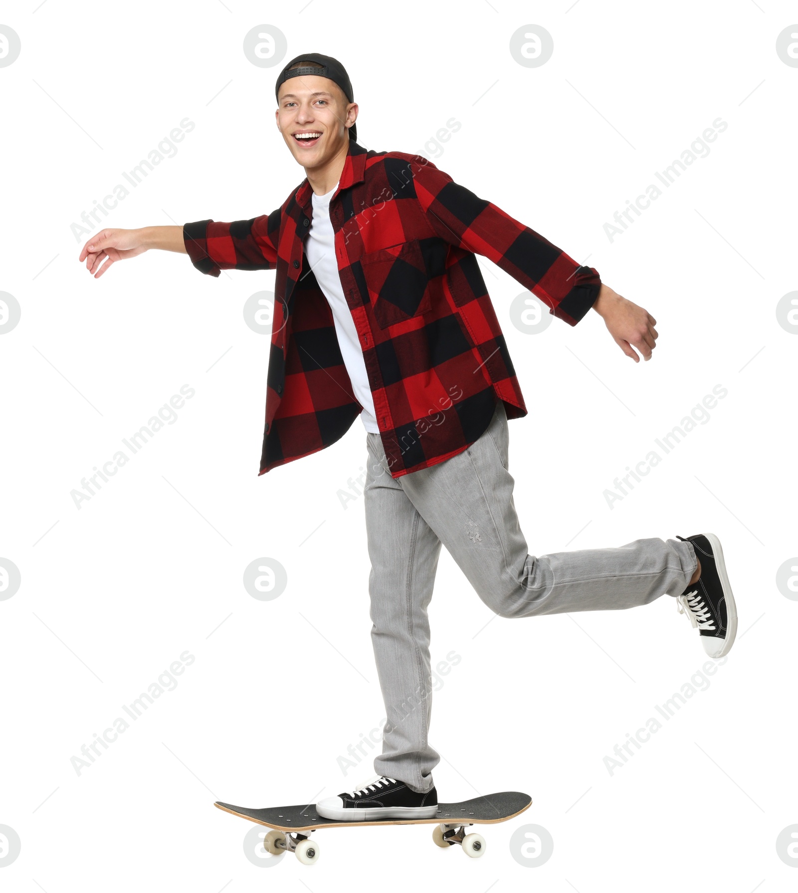 Photo of Happy man riding skateboard on white background