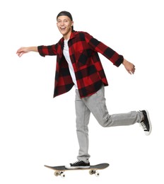 Photo of Happy man riding skateboard on white background