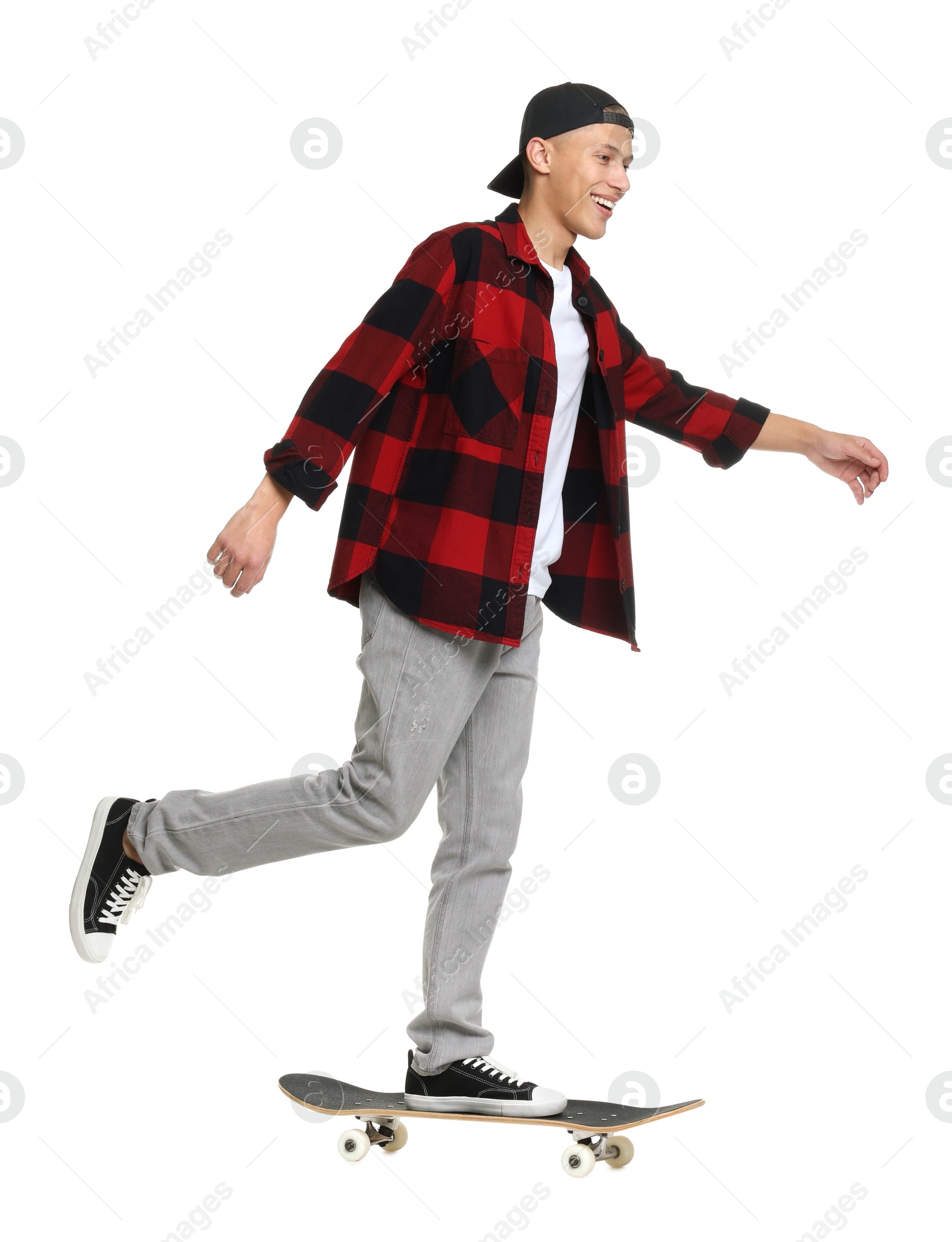 Photo of Happy man riding skateboard on white background