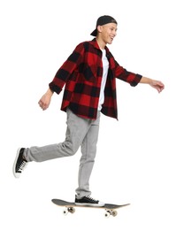 Photo of Happy man riding skateboard on white background