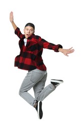 Photo of Handsome young skater jumping on white background