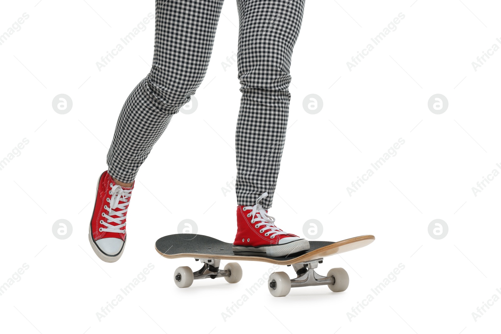 Photo of Woman riding skateboard on white background, closeup