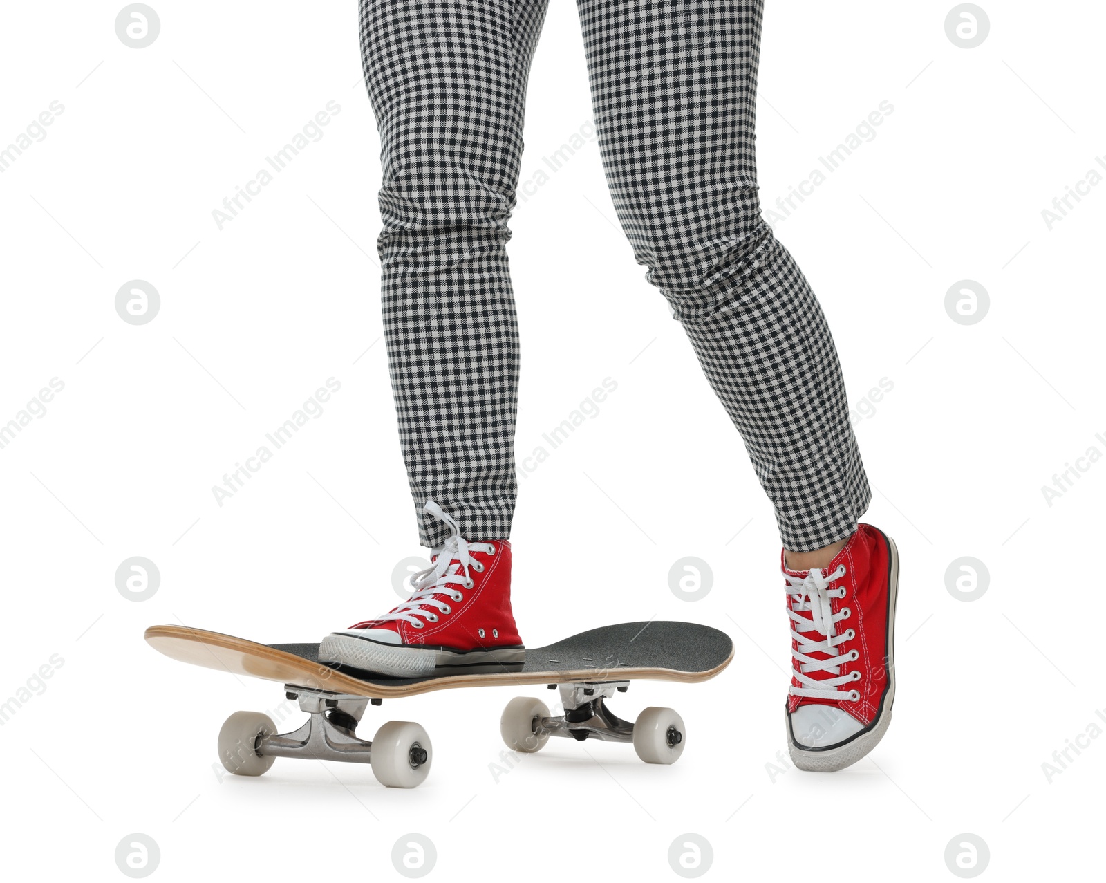 Photo of Woman riding skateboard on white background, closeup