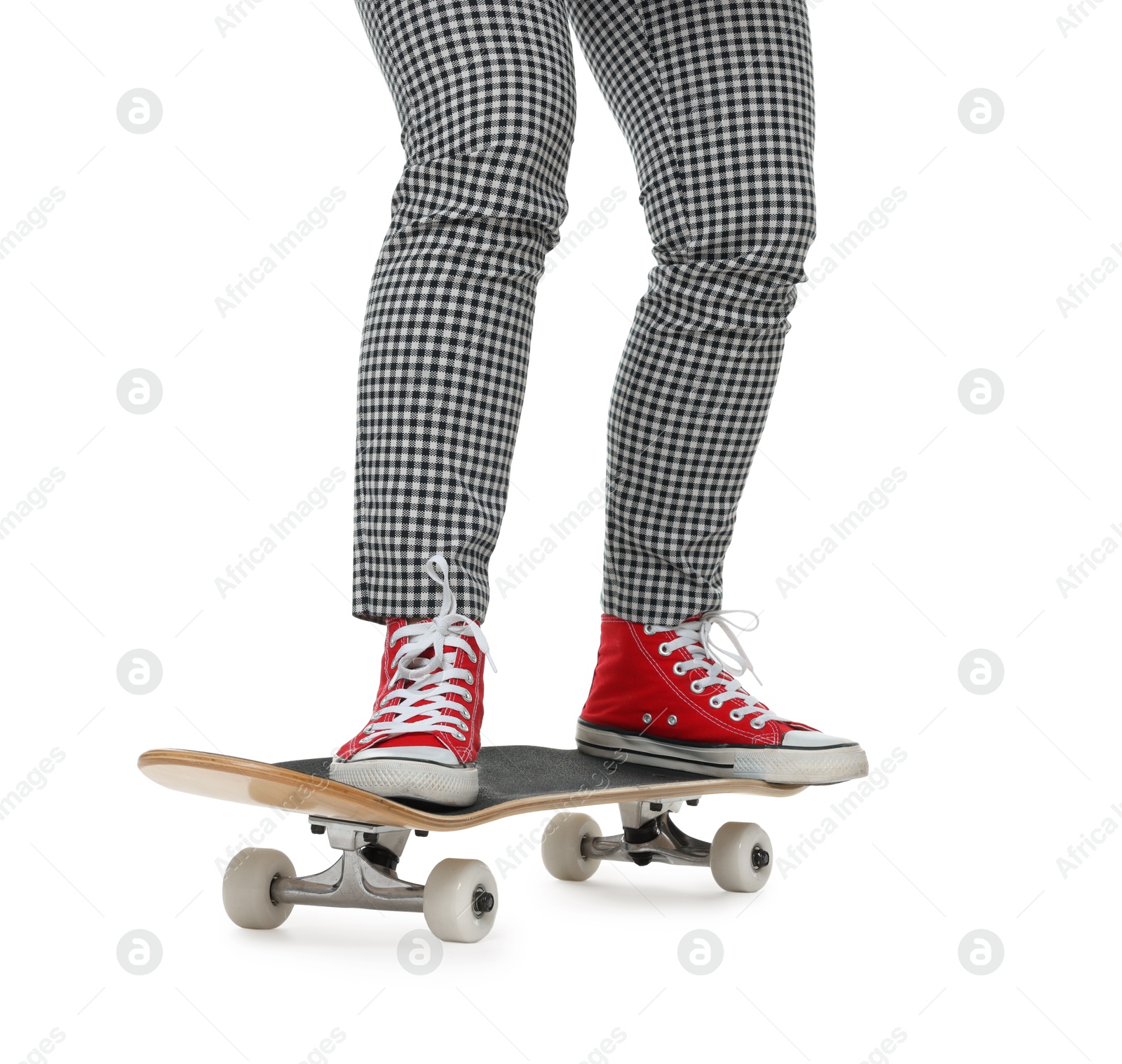 Photo of Woman riding skateboard on white background, closeup