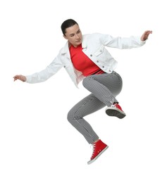 Photo of Beautiful female skater jumping on white background