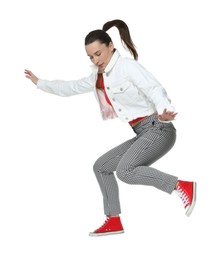 Photo of Beautiful female skater jumping on white background