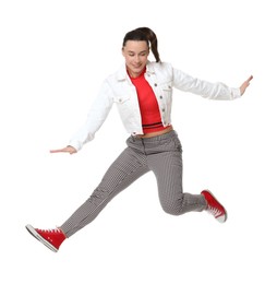 Photo of Smiling female skater jumping on white background