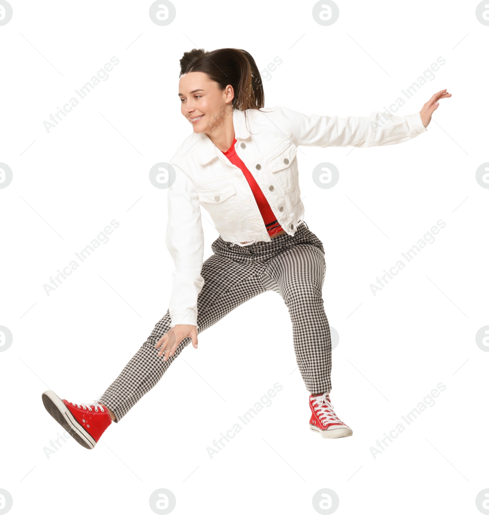 Photo of Smiling female skater jumping on white background