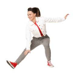 Photo of Smiling female skater jumping on white background