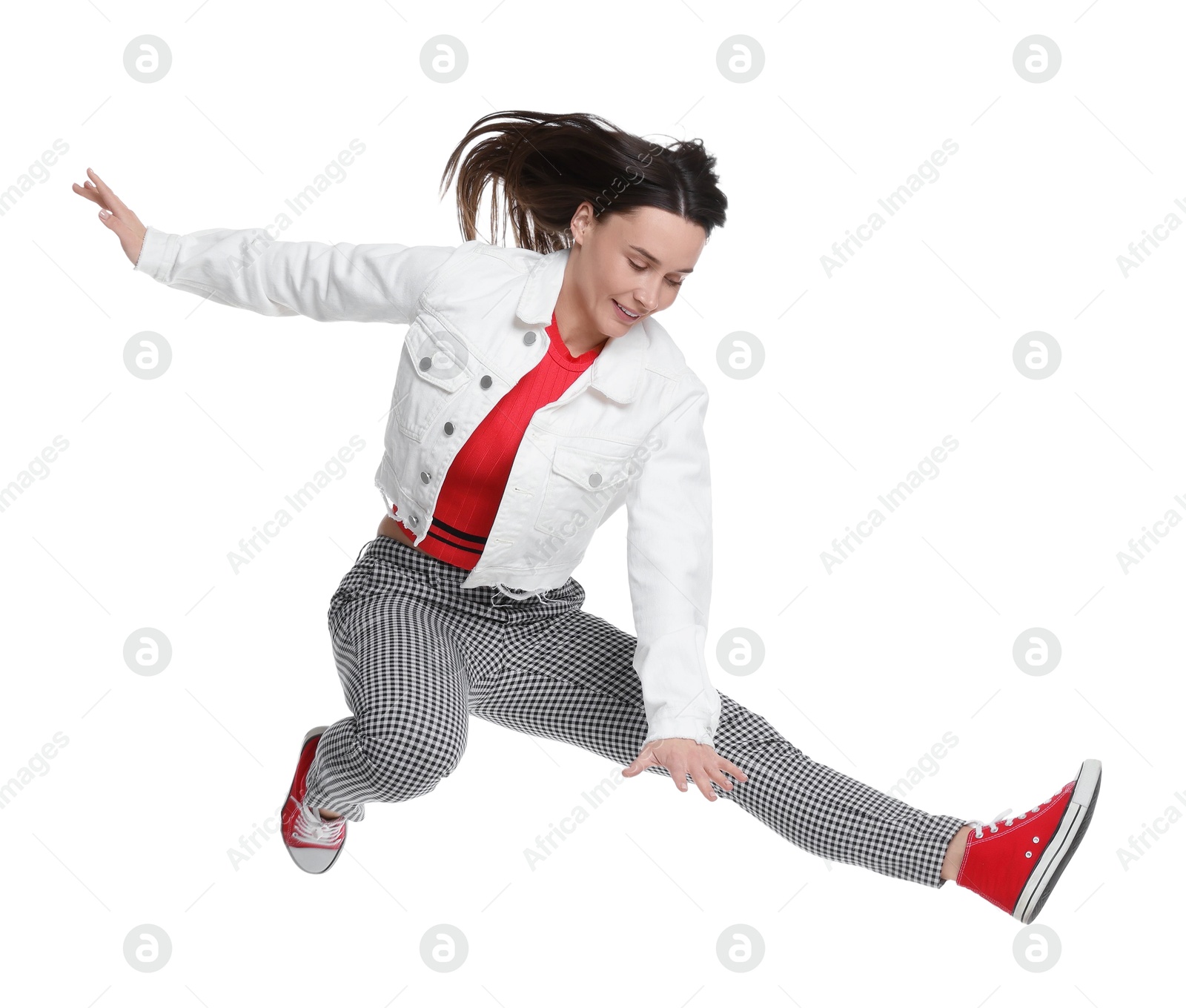 Photo of Smiling female skater jumping on white background