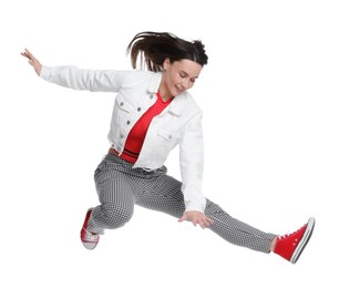 Photo of Smiling female skater jumping on white background