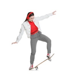 Photo of Smiling woman with skateboard on white background