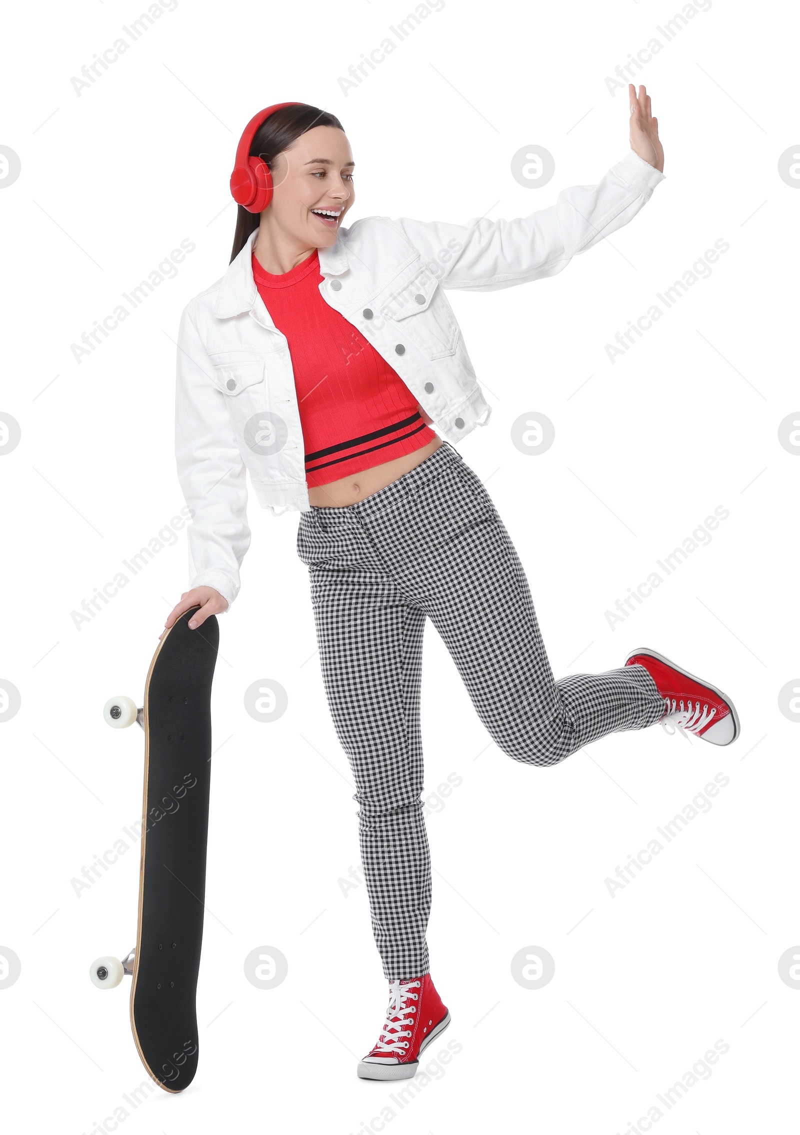 Photo of Smiling woman with skateboard waving hello on white background