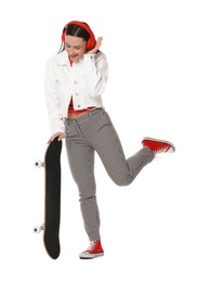 Photo of Smiling woman with skateboard on white background