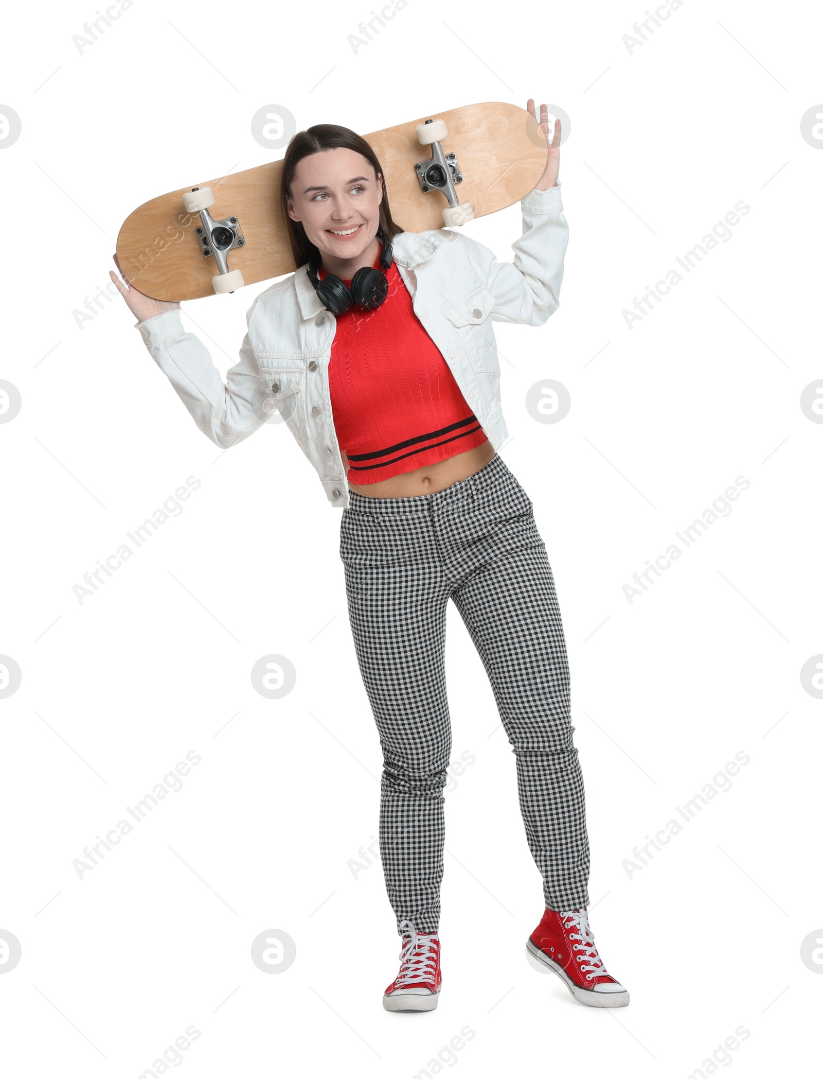 Photo of Smiling woman with skateboard on white background