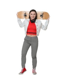 Photo of Smiling woman with skateboard on white background