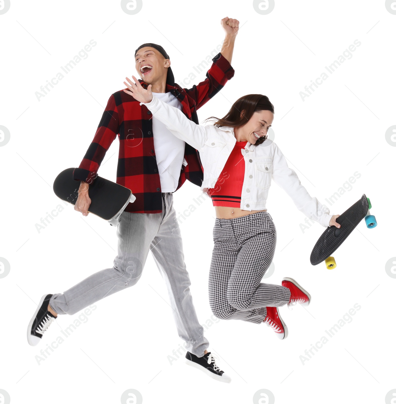 Photo of Happy friends jumping with skateboards on white background