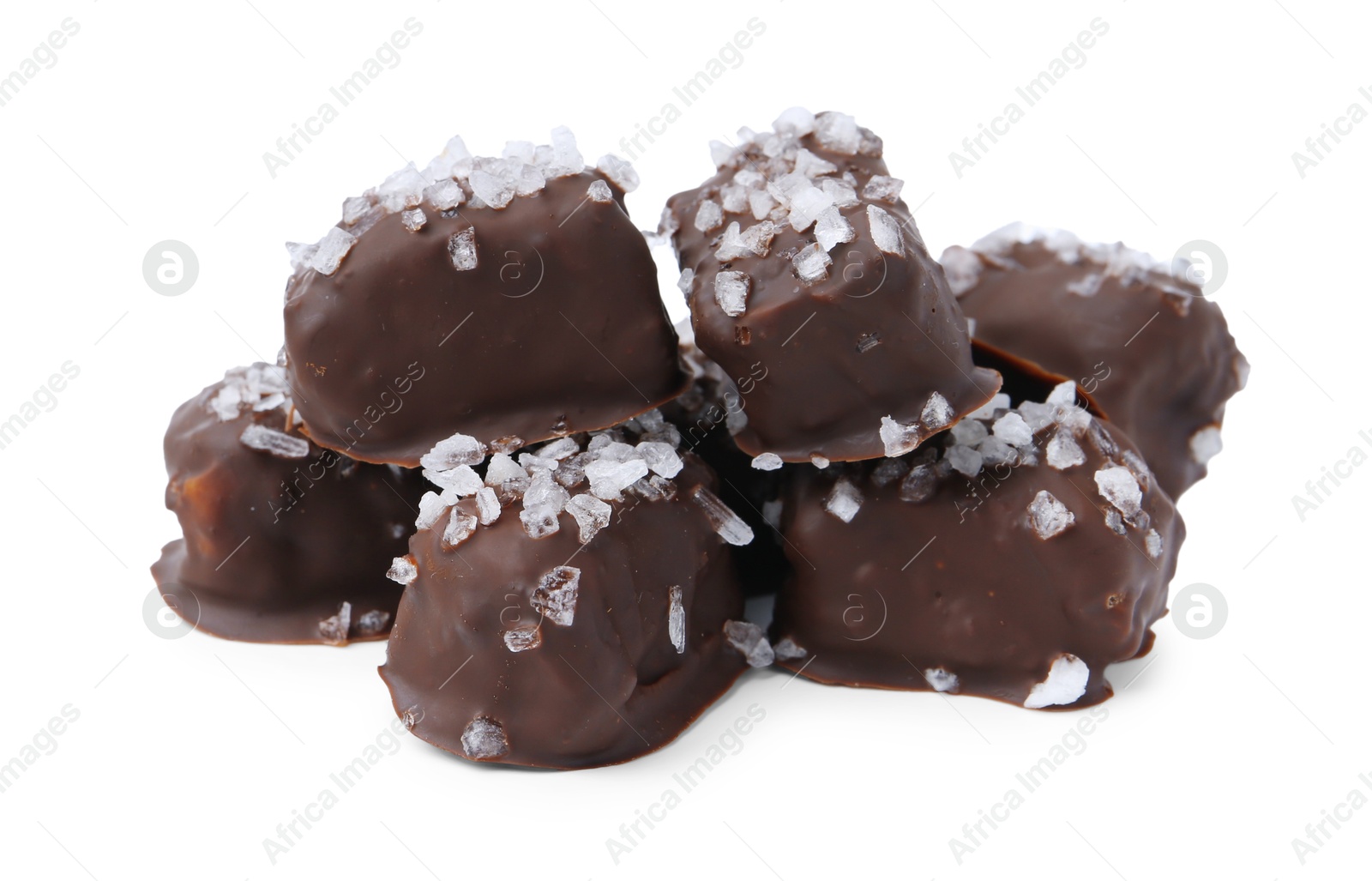 Photo of Tasty chocolate candies with salt isolated on white