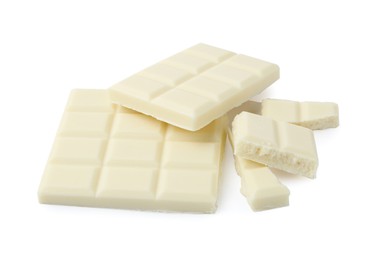 Photo of Pieces of delicious white chocolate isolated on white