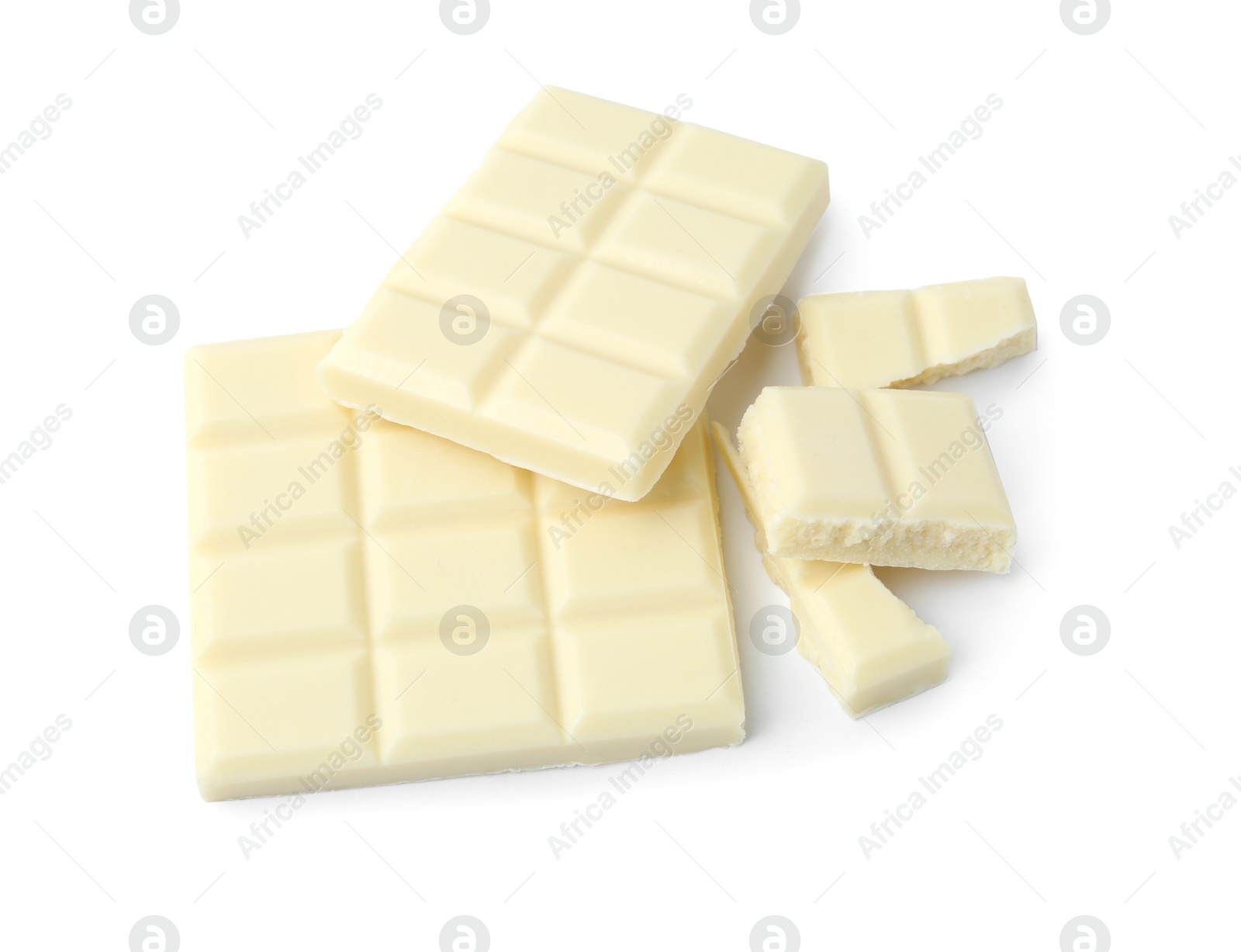 Photo of Pieces of delicious white chocolate isolated on white