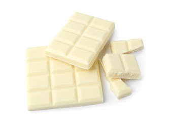 Photo of Pieces of delicious white chocolate isolated on white