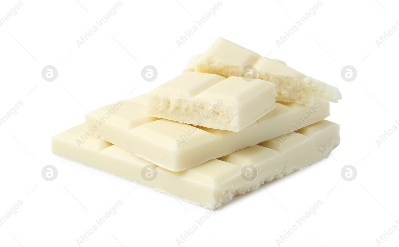 Photo of Pieces of delicious white chocolate isolated on white