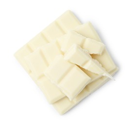 Photo of Pieces of delicious white chocolate isolated on white, top view