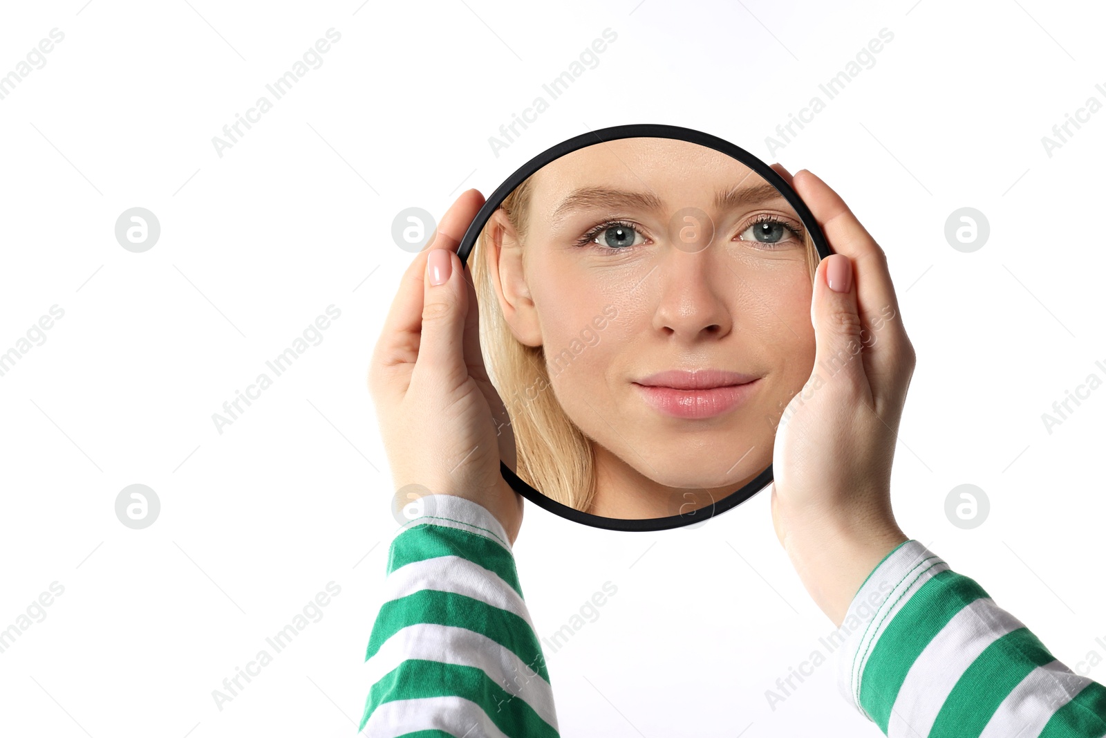 Image of Beautiful woman looking in small round mirror on white background, closeup