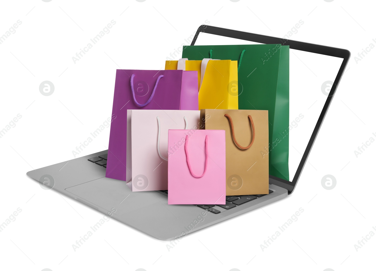 Image of Laptop with shopping bags isolated on white. Concept of online shopping, purchase via internet