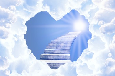 Image of Stairs leading to light in sky, view through heart shaped gap in clouds. Love of God, concept