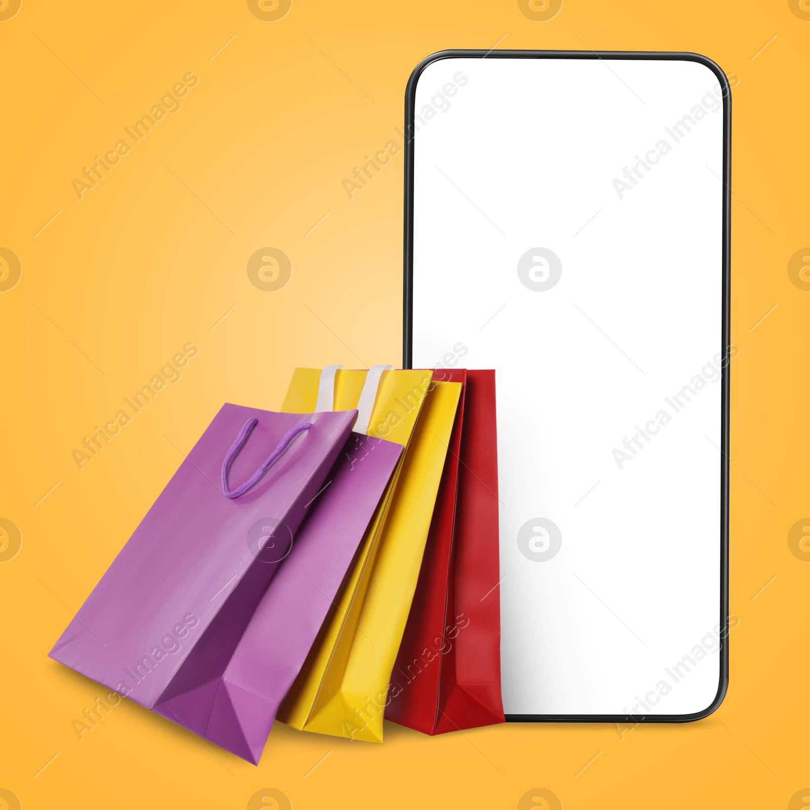 Image of Mobile phone and shopping bags on orange background. Concept of online shopping, purchase via internet