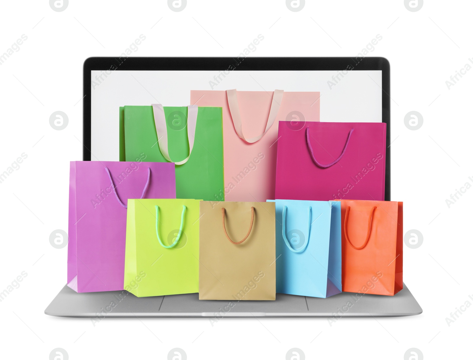 Image of Laptop with shopping bags isolated on white. Concept of online shopping, purchase via internet