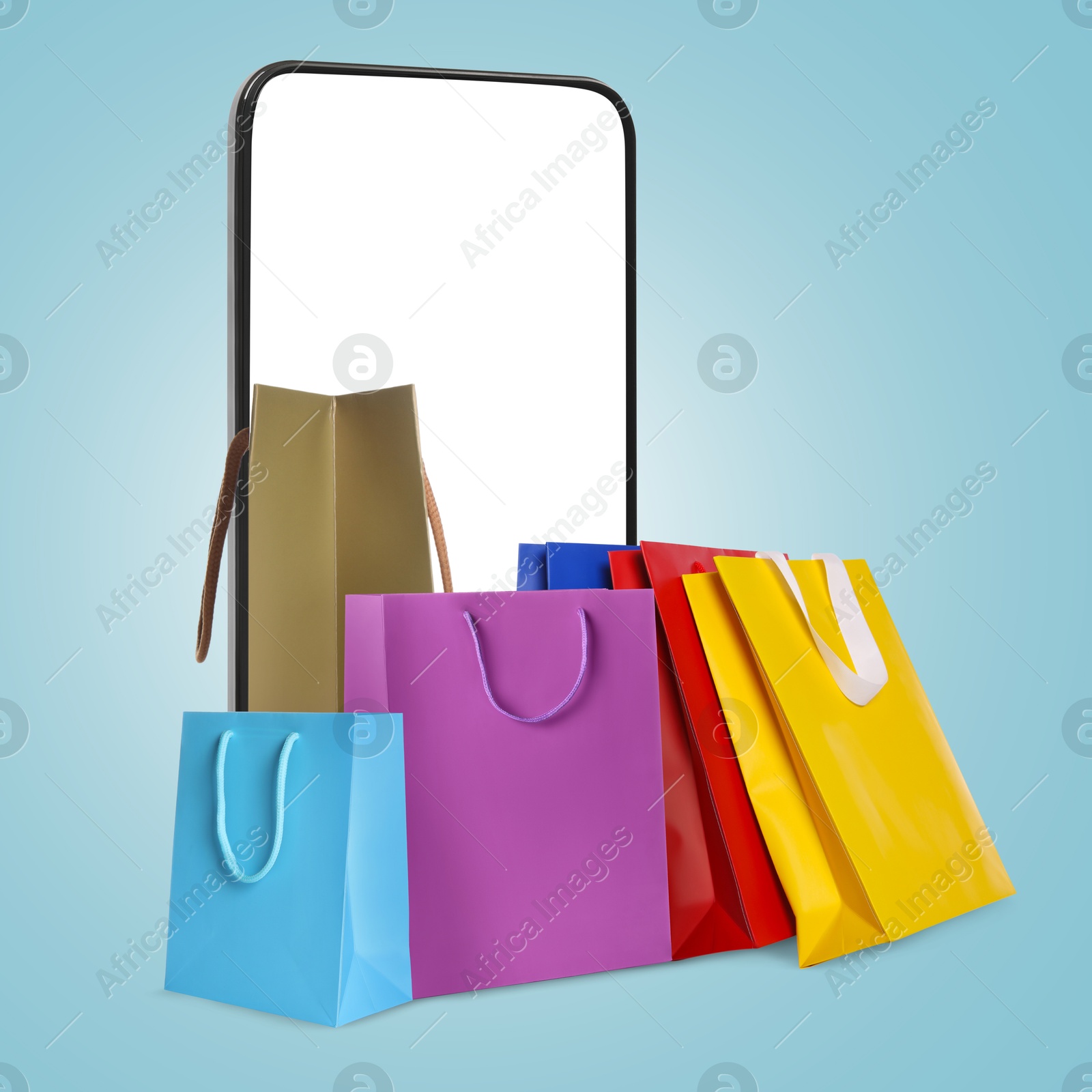 Image of Mobile phone with shopping bags on light blue background. Concept of online shopping, purchase via internet