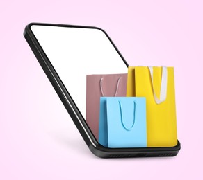 Image of Mobile phone with shopping bags on pink background. Concept of online shopping, purchase via internet