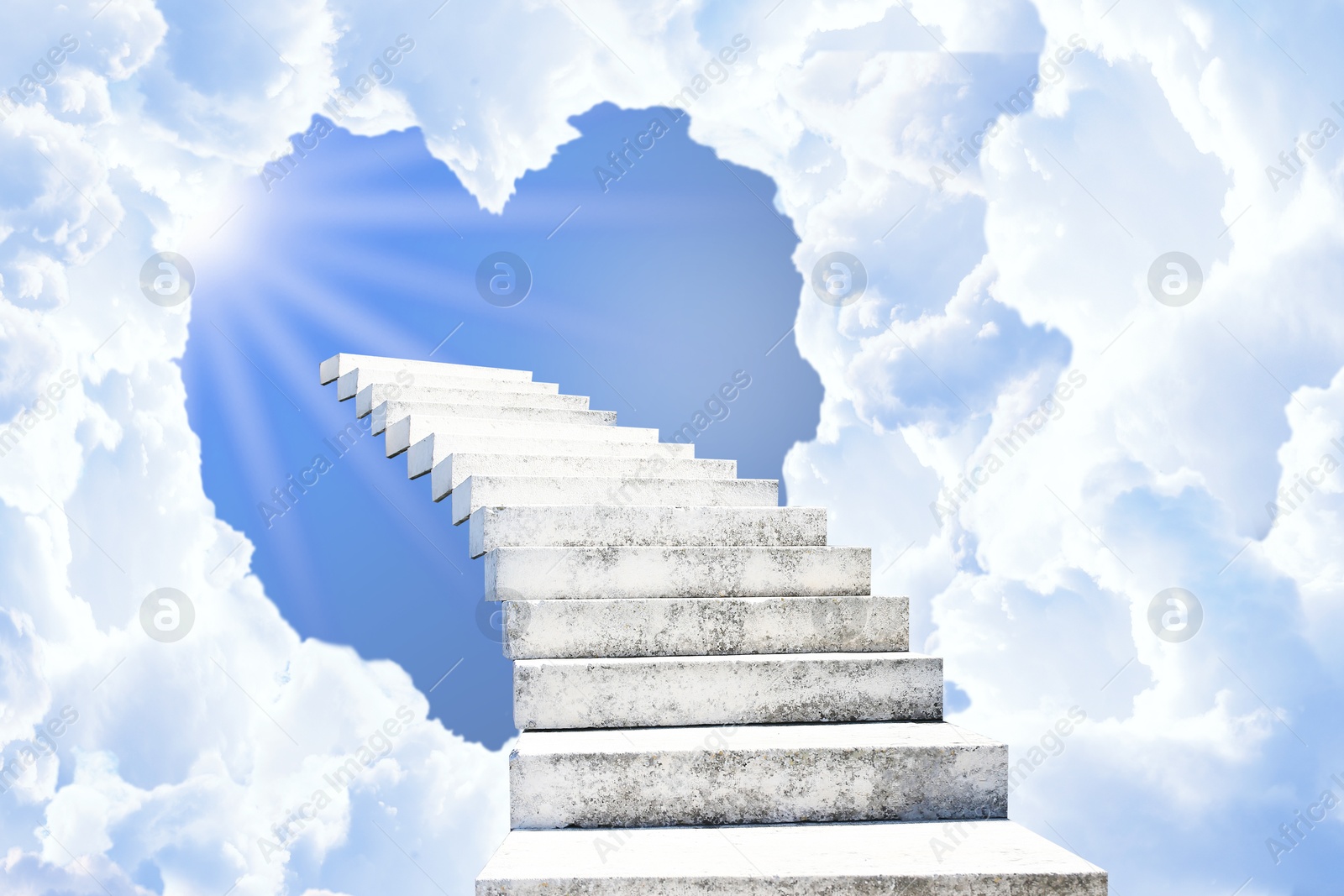 Image of Stairs leading to light in sky through heart shaped gap in clouds. Love of God, concept