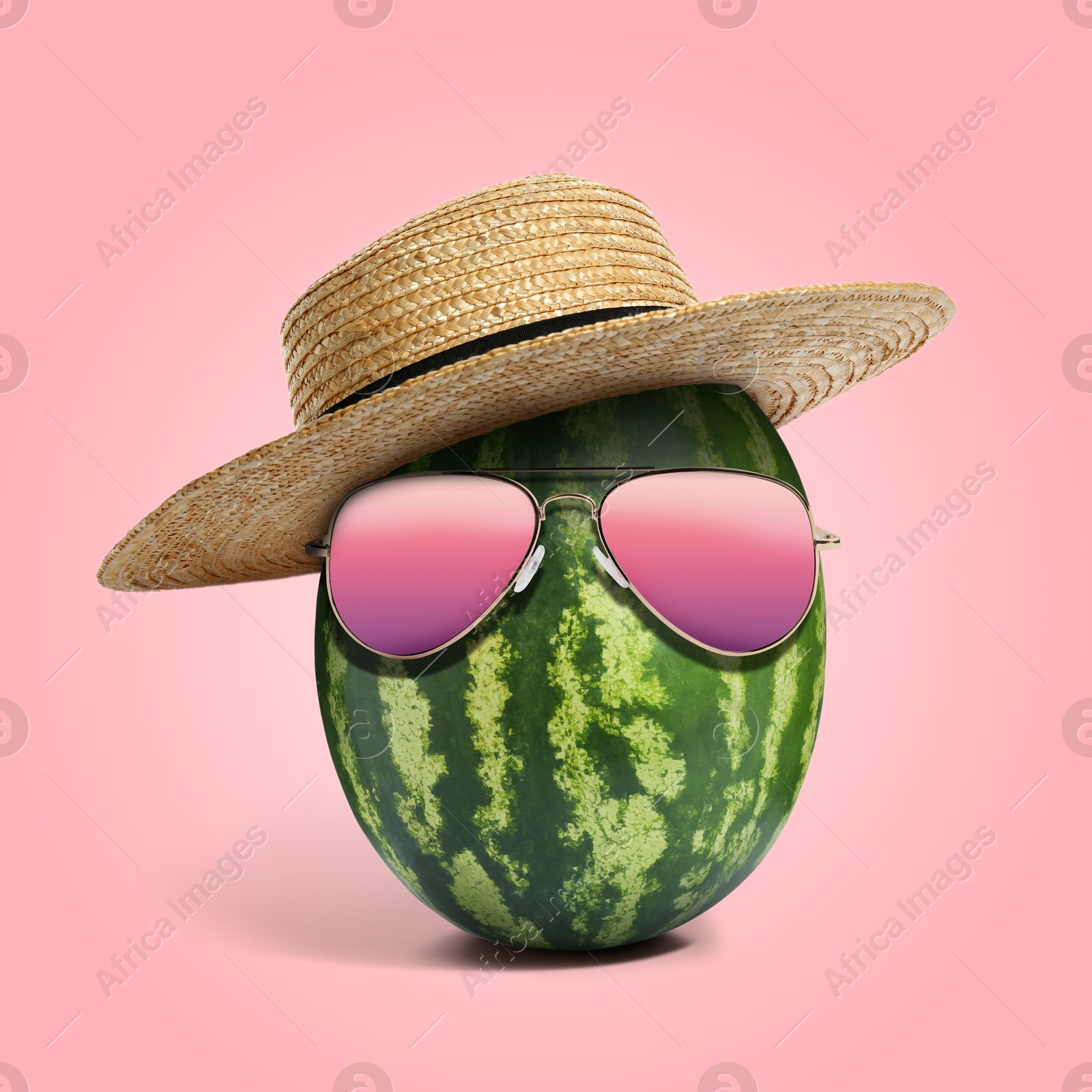 Image of Watermelon with straw hat and sunglasses on pink background