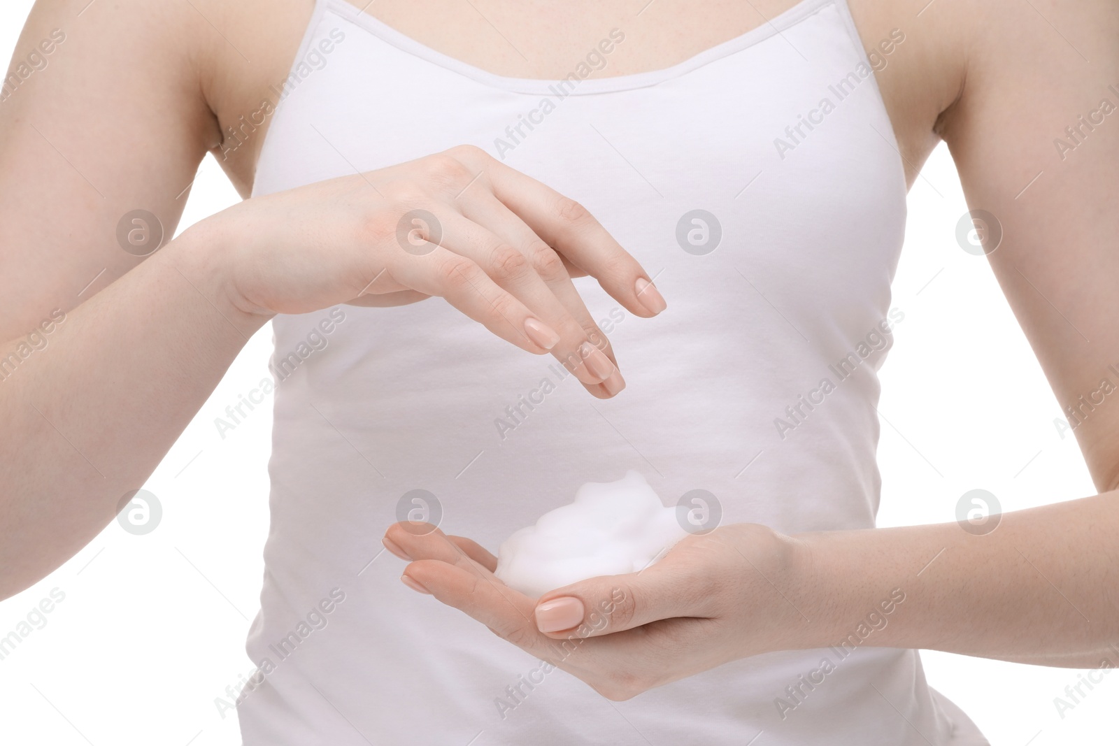 Photo of Woman with cleansing foam on hands against white background, closeup