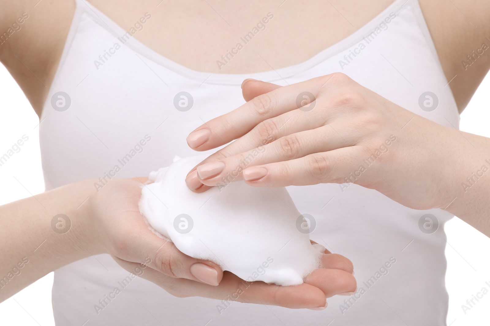 Photo of Woman with cleansing foam on hands against white background, closeup