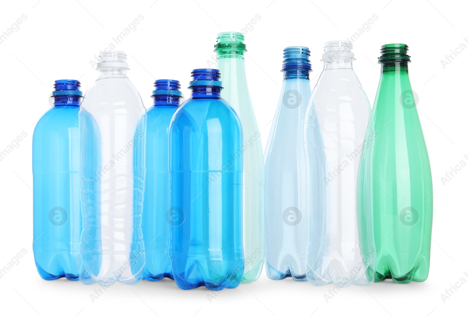 Photo of Many empty plastic bottles isolated on white