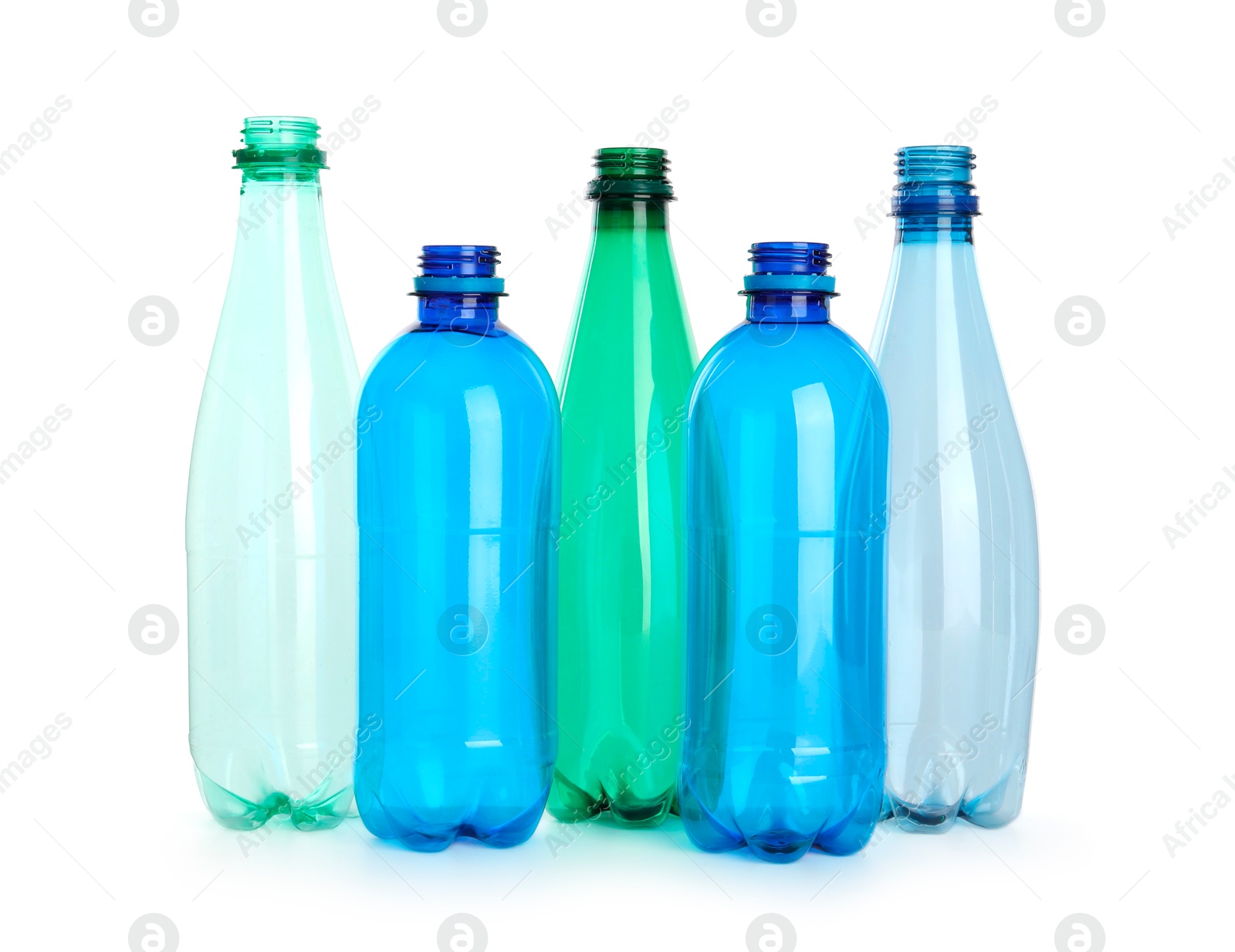 Photo of Many empty plastic bottles isolated on white