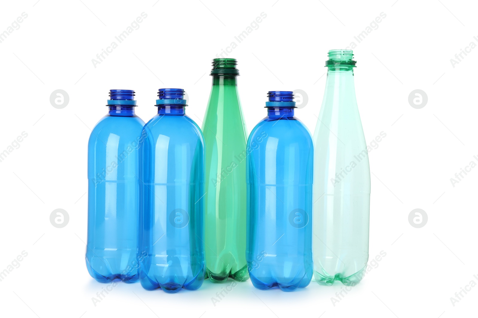 Photo of Many empty plastic bottles isolated on white