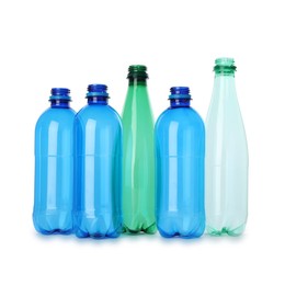 Photo of Many empty plastic bottles isolated on white