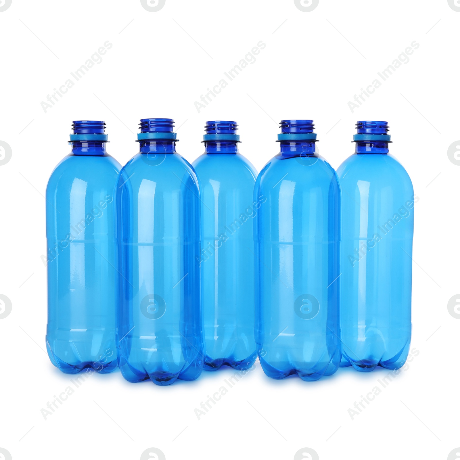 Photo of Many empty plastic bottles isolated on white