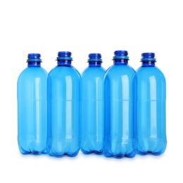 Photo of Many empty plastic bottles isolated on white