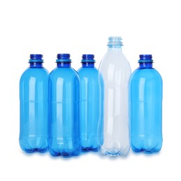 Photo of Many empty plastic bottles isolated on white