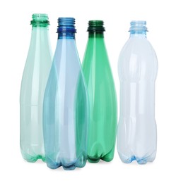 Photo of Many empty plastic bottles isolated on white